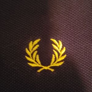 Fred Perry discontinued shirt.  Black with yellow